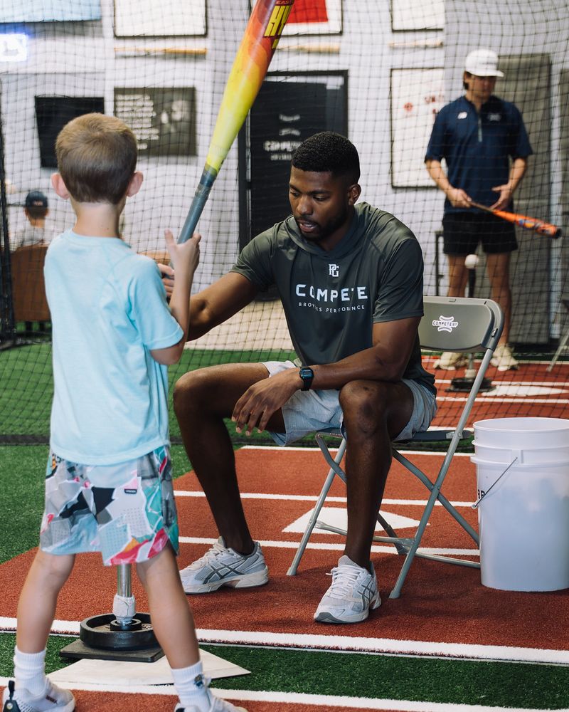 Young hitter working with a Compete BP coach