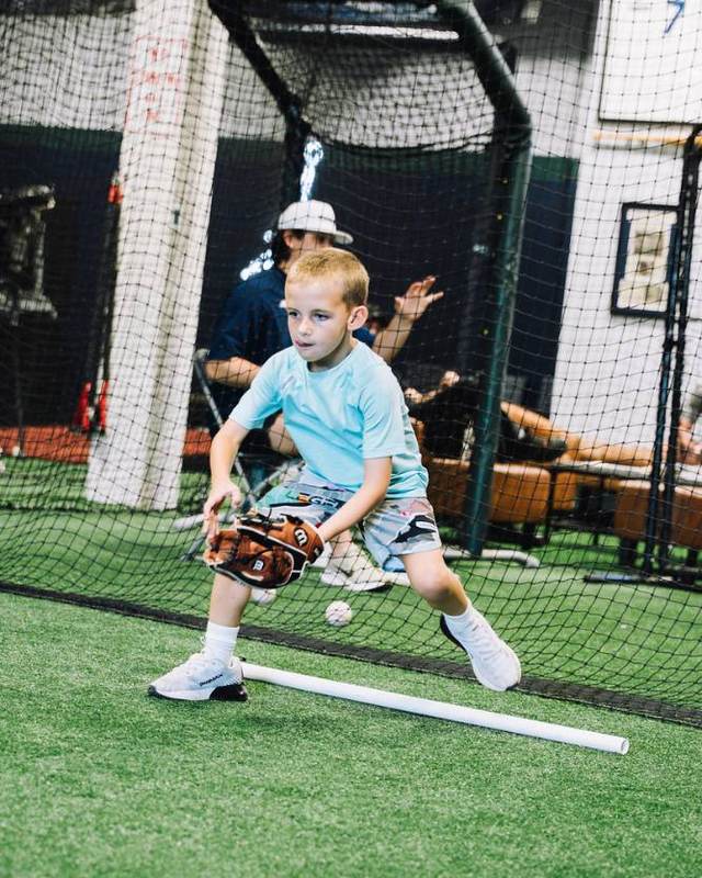 Young infielder fielding a ground ball