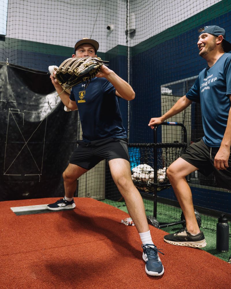 Pitcher on the mound working with a Compete BP coach