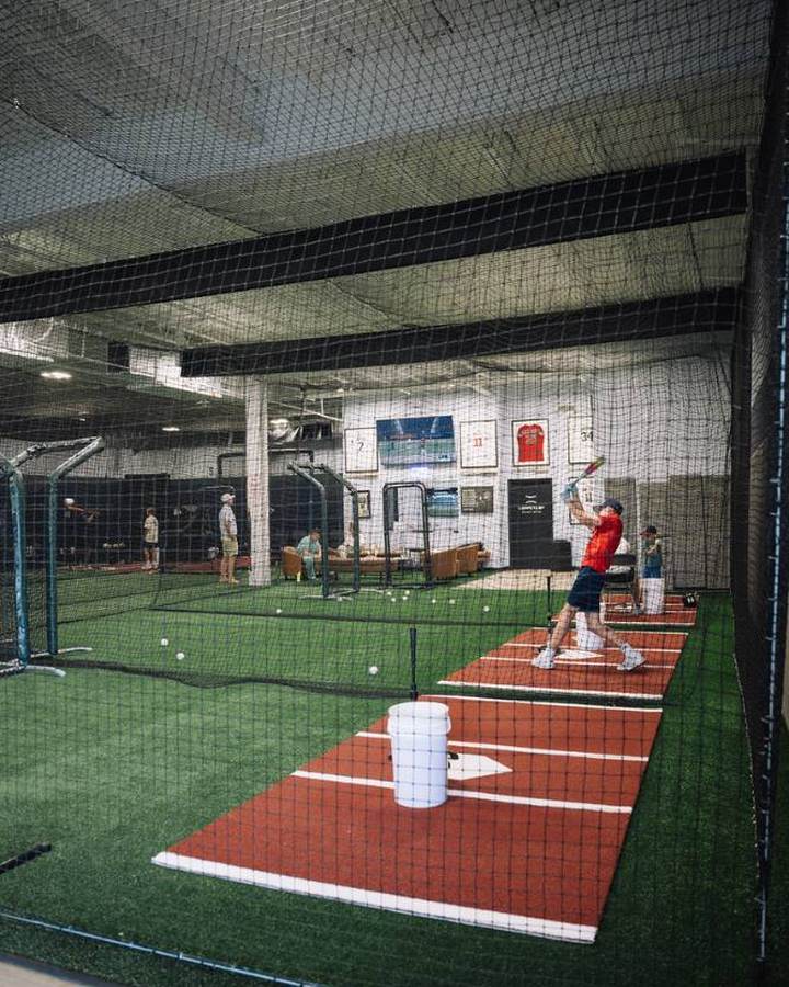 Long batting cage with turf and pitching mound
